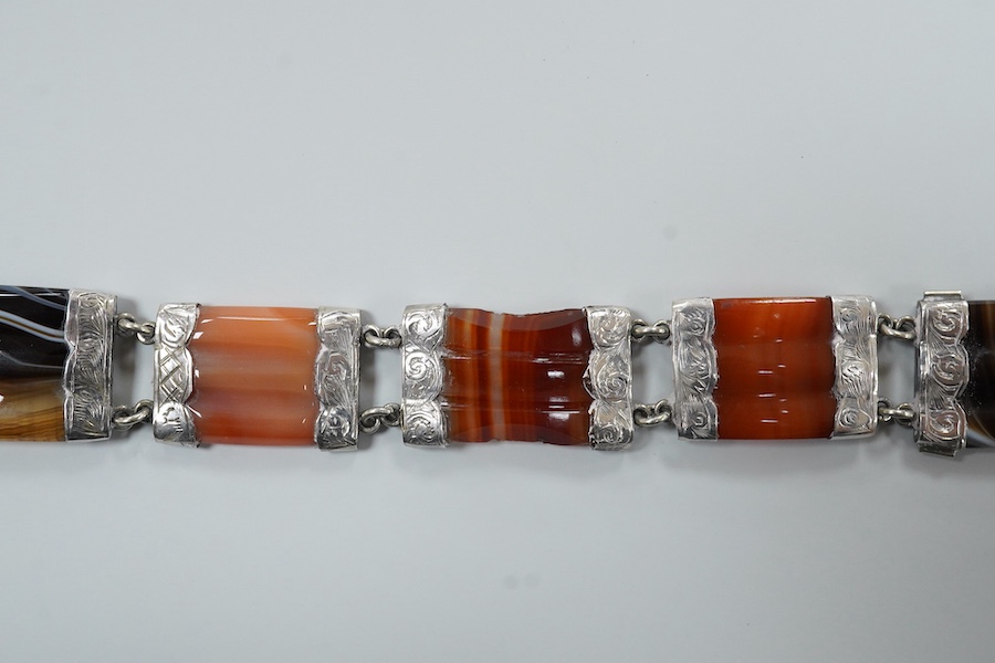 A Victorian Scottish engraved white metal and banded agate set bracelet, with buckle clasp, overall length 21.8cm.